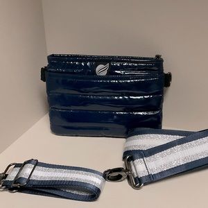 Think Royln Navy Puffy Bum Belt Bag with metallic silver and navy straps